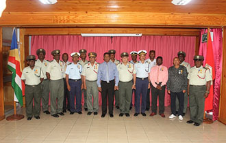 President Faure presents medals to long serving personnel at SPDF